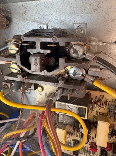 Expert AC electrical system diagnosis and repair by certified HVAC professionals DiMartino's HVAC technician diagnosing AC system electrical components and wiring during repair service in Salem Oregon