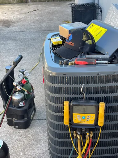 Professional HVAC diagnostic equipment on air conditioning unit