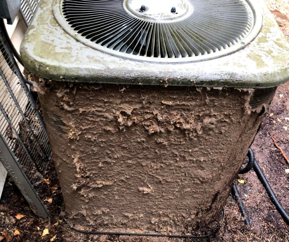 Dirty clogged air conditioner condenser unit with debris that needs cleaning in Salem, OR