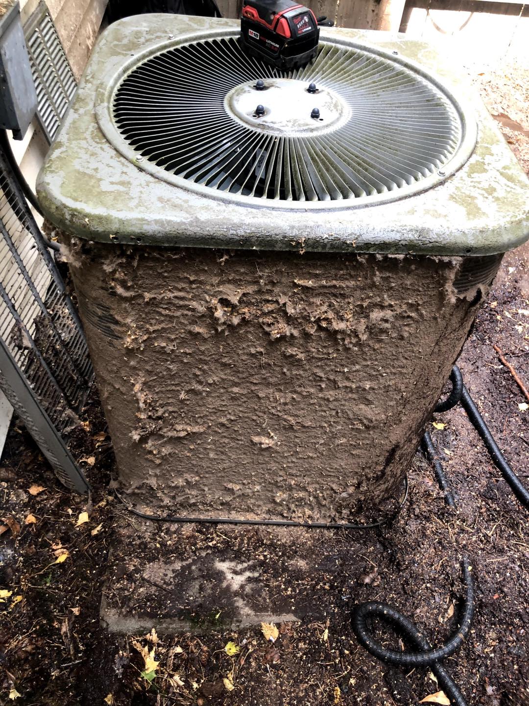 Air conditioning condenser unit receiving professional maintenance service in Salem Oregon