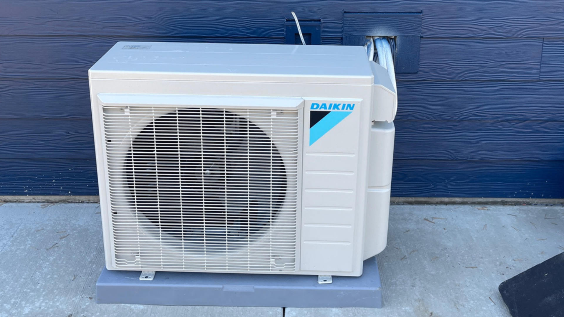 Daikin ductless mini-split outdoor unit installed on concrete pad in Salem, OR