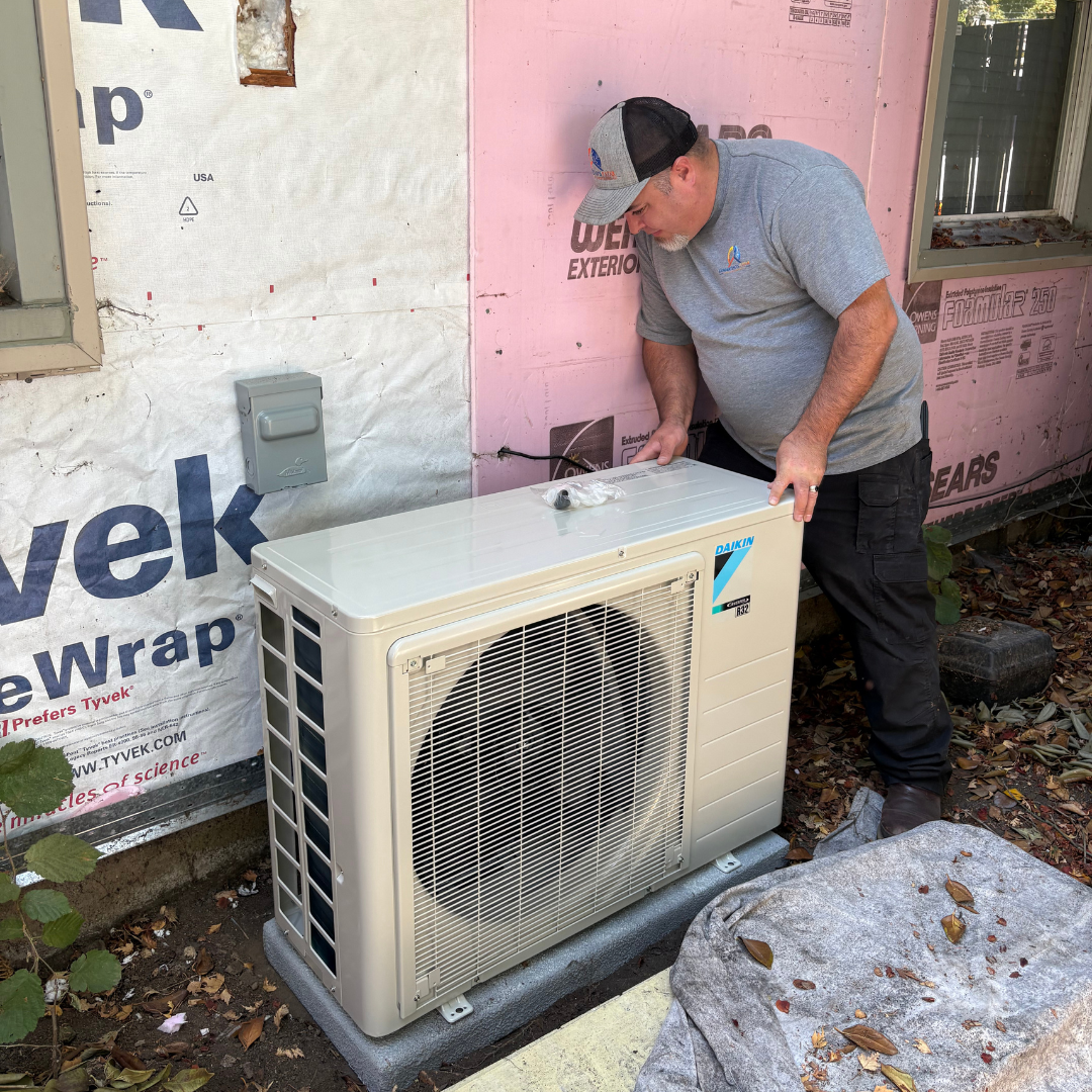 DiMartino's 5 Star technician installing a Daikin outdoor condenser unit at a Salem, Oregon home